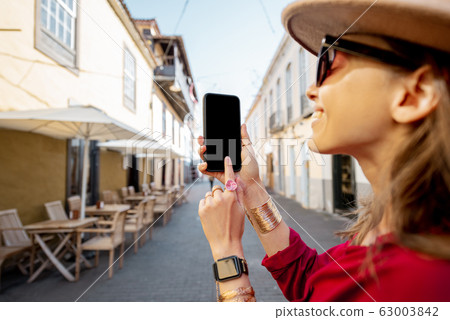 Woman traveling in the old town La Laguna on Tenerife island 63003842