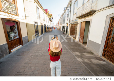 Woman traveling in the old spanish town on Tenerife island 63003861