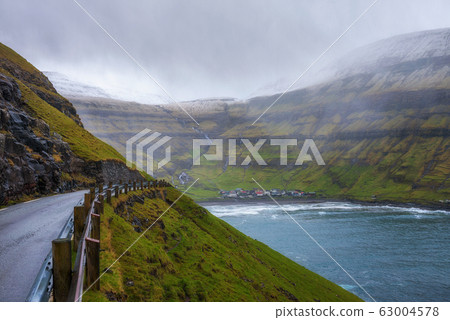 Road going to the village of Tjornuvik in the Faroe Islands, Denmark Road going to the village of Tjornuvik in the Faroe Islands, Denmark 63004578