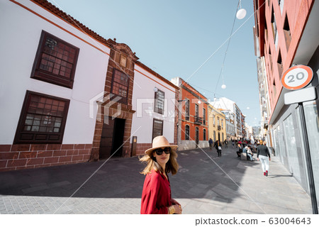 Woman traveling in the old town La Laguna on Tenerife island Woman traveling in the old town La Laguna on Tenerife island 63004643