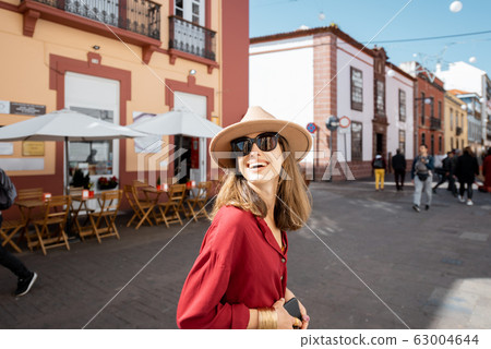 Woman traveling in the old town La Laguna on Tenerife island 63004644