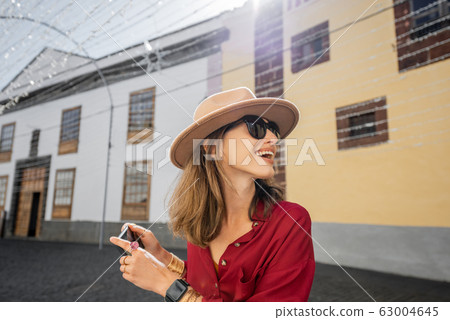 Woman traveling in the old town La Laguna on Tenerife island 63004645