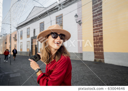 Woman traveling in the old town La Laguna on Tenerife island 63004646