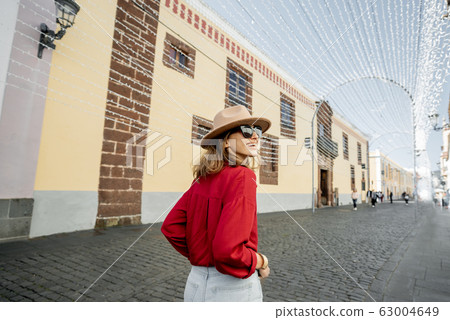 Woman traveling in the old town La Laguna on Tenerife island 63004649