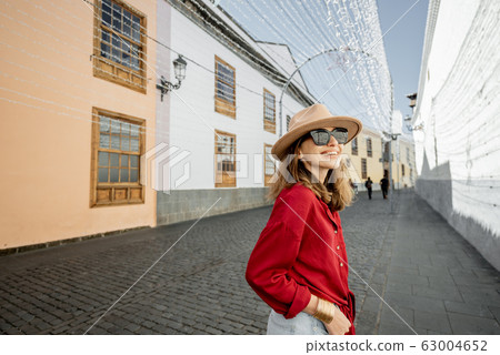 Woman traveling in the old town La Laguna on Tenerife island Woman traveling in the old town La Laguna on Tenerife island 63004652