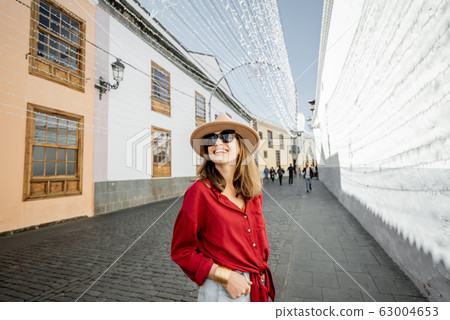 Woman traveling in the old town La Laguna on Tenerife island 63004653