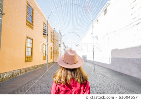 Woman traveling in the old spanish town on Tenerife island 63004657