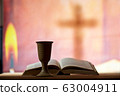 Still life with chalice of wine and open bible 63004911