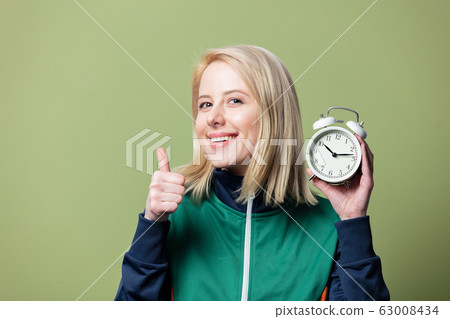 Beautiful blonde woman in 90s sport suit with 63008434