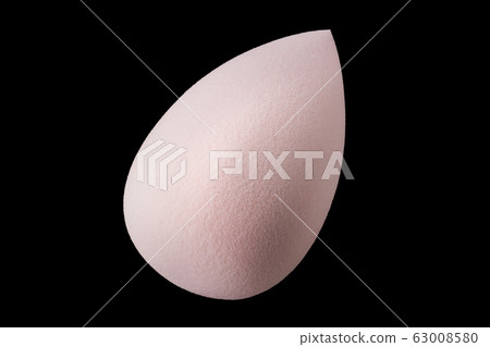 Makeup tool sponge or beauty blender isolated on black background 63008580