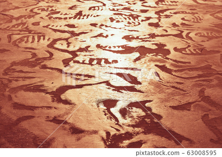 Sea shore with orange sand Sea shore with orange sand 63008595