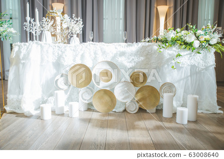 A very nicely decorated wedding table with plates A very nicely decorated wedding table with plates 63008640