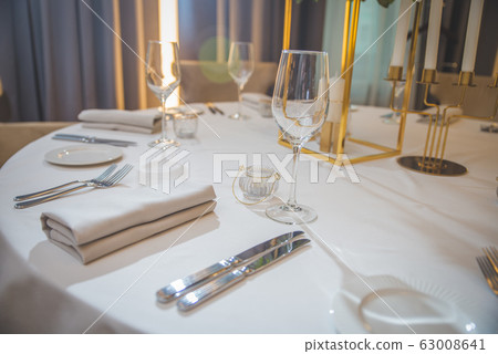 Table setting at a luxury wedding reception Table setting at a luxury wedding reception 63008641