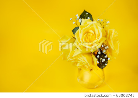 Yellow rose flowers bouquet with green leaves in 63008745
