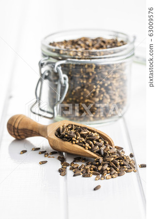 Milk thistle seeds. Milk thistle seeds. 63009576