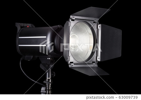Photography studio flash isolated on black background with lamp. Photography studio flash isolated on black background with lamp. 63009739