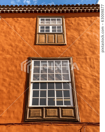 Architectural fragment of the old building in colonial style Architectural fragment of the old building in colonial style 63009877