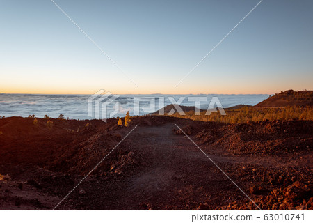 Rocky terrain above the clouds Rocky terrain above the clouds 63010741