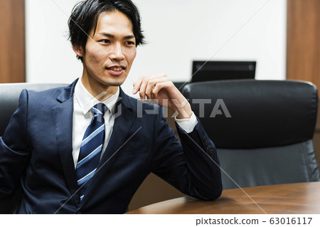 Young businessman (conference room, suit, meeting) Young businessman (conference room, suit, meeting) 63016117
