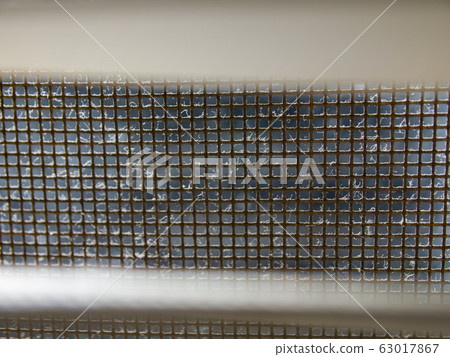 Dust blinds inside a window, Dust and Dirty mosquito wire screen window, Light & Shadow shot, Close up and macro shot, Selective focus Dust blinds inside a window, Dust and Dirty mosquito wire screen window, Light & Shadow shot, Close up and macro shot, Selective focus 63017867
