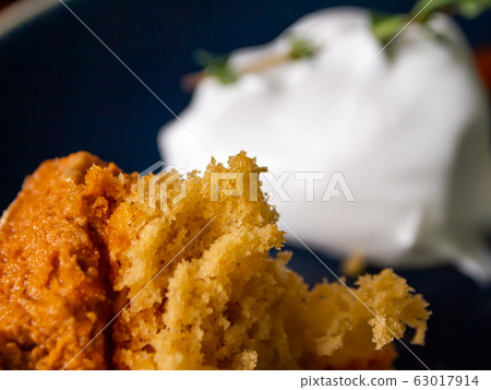 Remnants of cake on a blue plate, Close up and Macro shot, Selective focus Remnants of cake on a blue plate, Close up and Macro shot, Selective focus 63017914