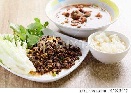 Local Northern Thai food, spicy minced pork salad (Larb Moo Kua) Local Northern Thai food, spicy minced pork salad (Larb Moo Kua) 63025422