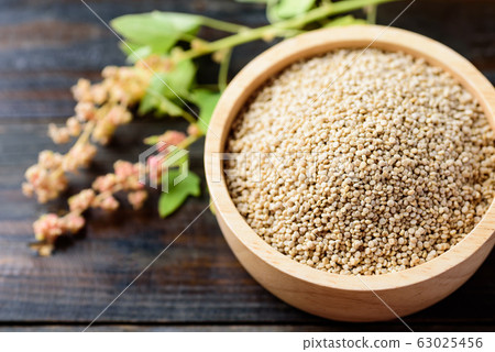 Organic raw brown quinoa seed in a bowl, healthy food Organic raw brown quinoa seed in a bowl, healthy food 63025456