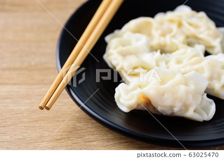 Steamed wonton dumpling stuffed with minced pork and shrimp Steamed wonton dumpling stuffed with minced pork and shrimp 63025470