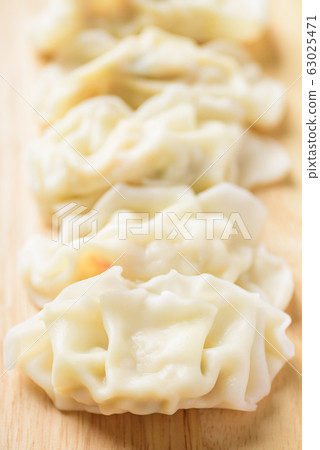 Steamed wonton dumpling stuffed with minced pork and shrimp, Asian food Steamed wonton dumpling stuffed with minced pork and shrimp, Asian food 63025471