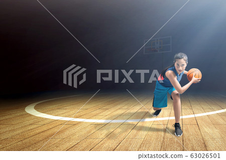 Asian woman basketball player in action with the ball 63026501