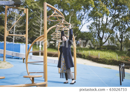A woman in the park A woman in the park 63026733