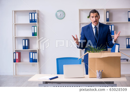 Young employee being made redundant Young employee being made redundant 63028509