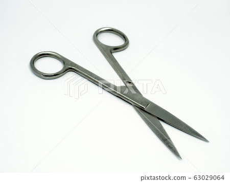 Stainless steel surgical scissors on the  white 63029064