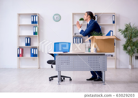 Young employee being made redundant Young employee being made redundant 63029203