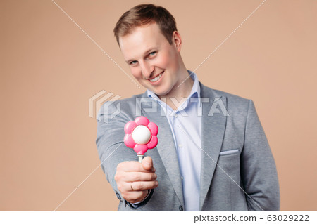 Portrait of beautiful man in grrey and blue office 63029222