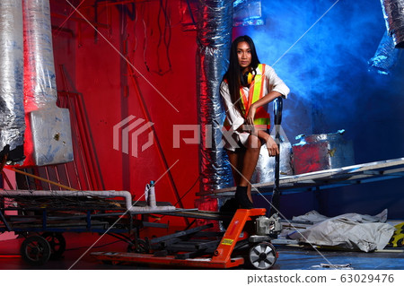 Beautiful Asian Architect Engineer woman in yellow 63029476