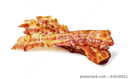 Closeup of slices of crispy hot fried bacon 63030031