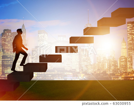 Businessman in career promotion concept with stairs 63030955