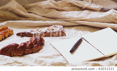 Breads and toast for breakfast and note book Breads and toast for breakfast and note book 63031521