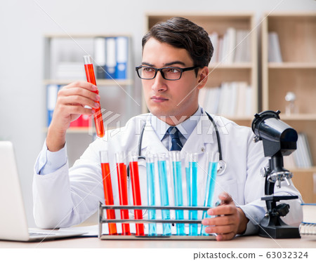 Man doctor working in the lab 63032324