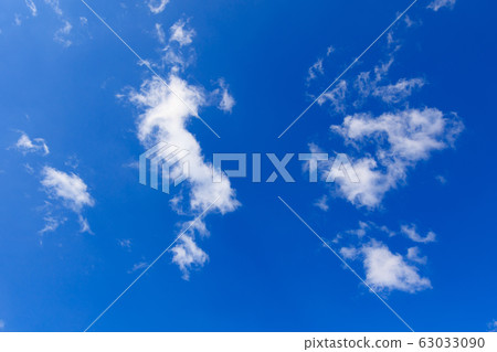 Clouds on a blue sky as a background 63033090