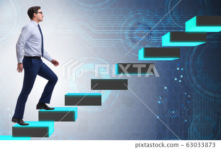 Young businessman climbing career ladder 63033873
