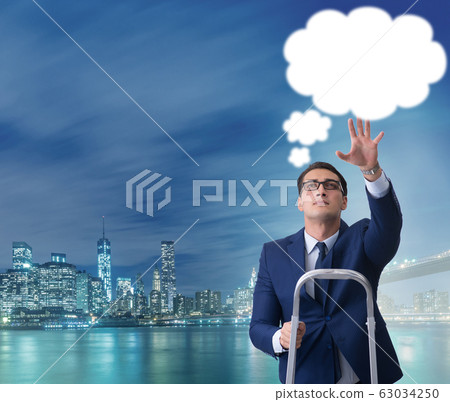 Businessman reaching out to callout message Businessman reaching out to callout message 63034250