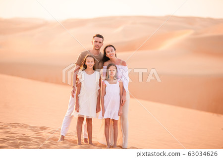 People among dunes in Rub al-Khali desert in United Arab Emirates 63034626