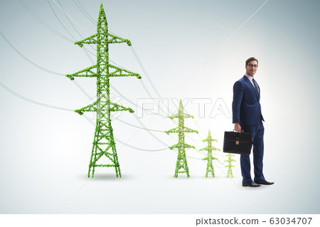 Businessman in green energy concept Businessman in green energy concept 63034707