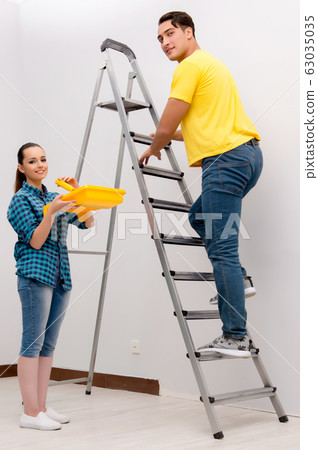 Wife and husband family doing home improvements Wife and husband family doing home improvements 63035035