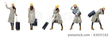 Woman with suitcase ready for winter vacation Woman with suitcase ready for winter vacation 63035182