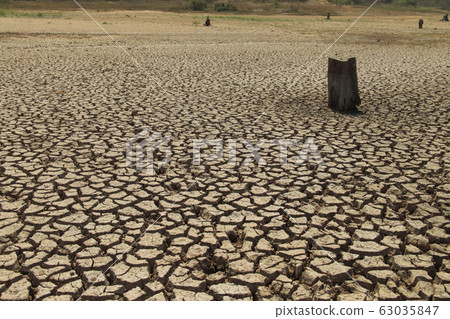 Cracked earth from arid drought weather in dam or Cracked earth from arid drought weather in dam or 63035847