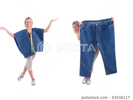 Woman in dieting concept with big jeans 63036217