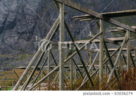Empty norwegian fish dryers on  Lofoten Islands 63036274